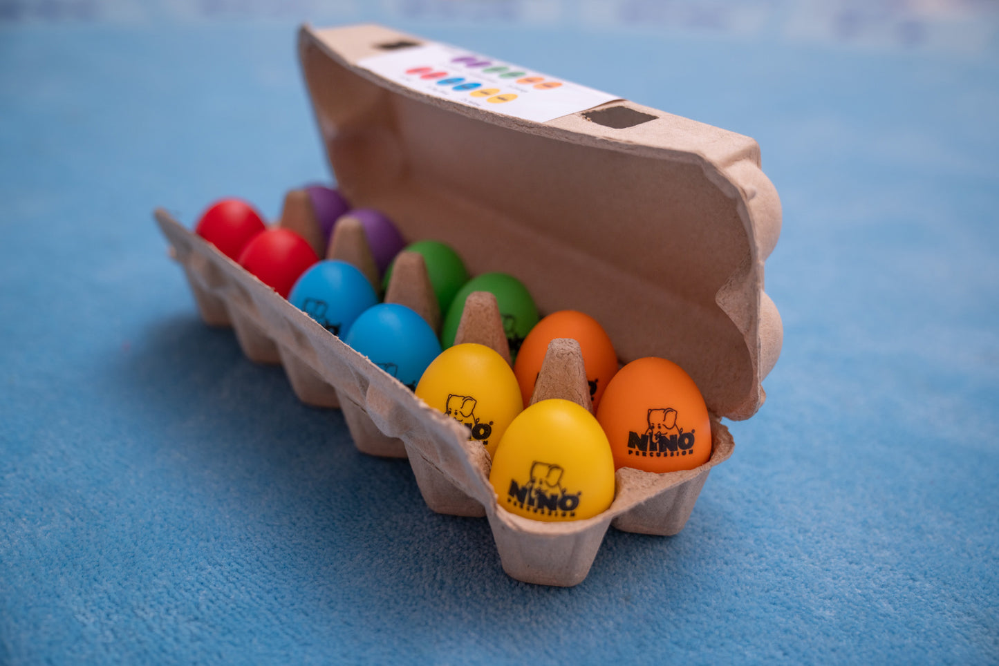 12 oeufs shaker NINO couleurs + boîte de rangement/présentation